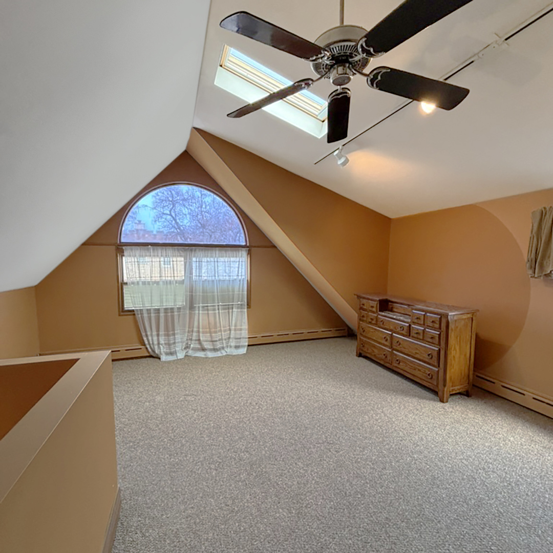 2133 West Grace Street, Unit 2 Chicago, IL 60618 - Photo 9 of 22 a view of an empty room with a window