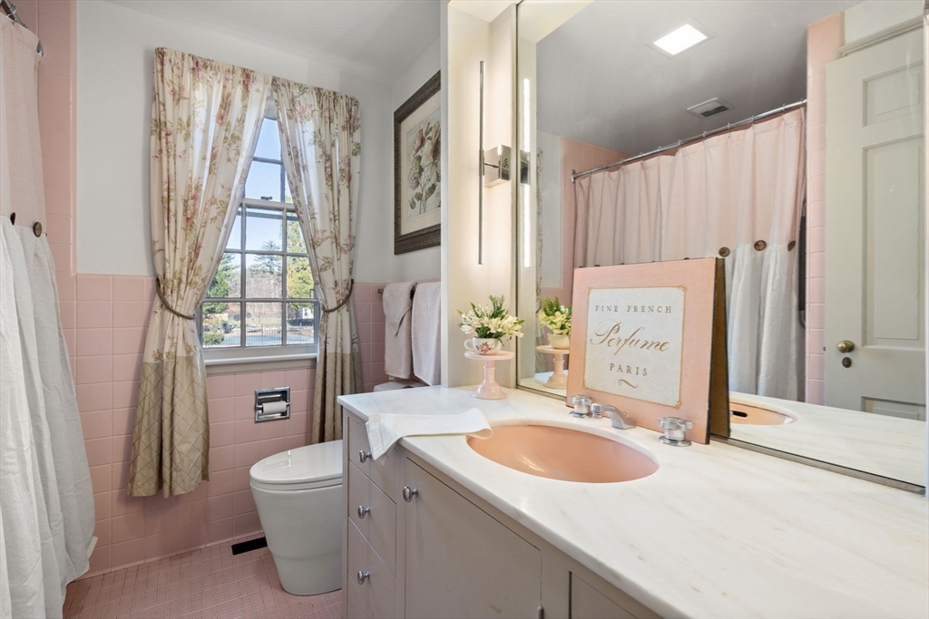 5 Herrick Road Boxford, MA 01921 - Photo 23 of 37 a bathroom with a sink a toilet and a mirror