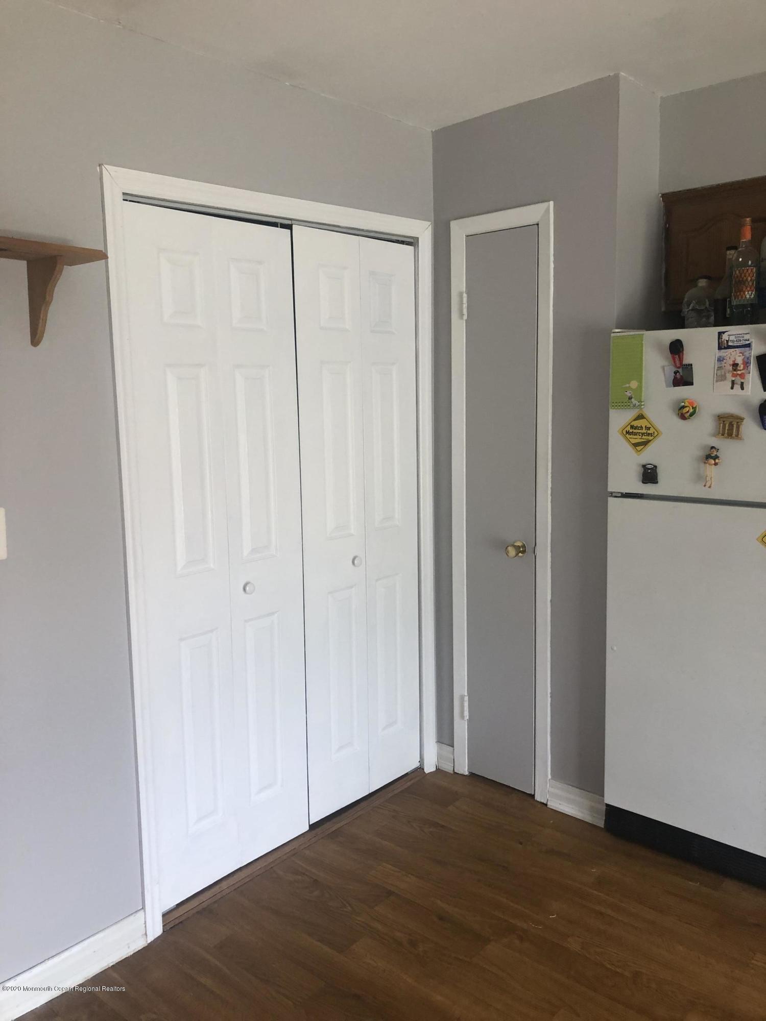 72 Greenwood Loop Road Brick, NJ 08724 - Photo 8 of 15 a view of a bedroom with wooden floor and cabinet