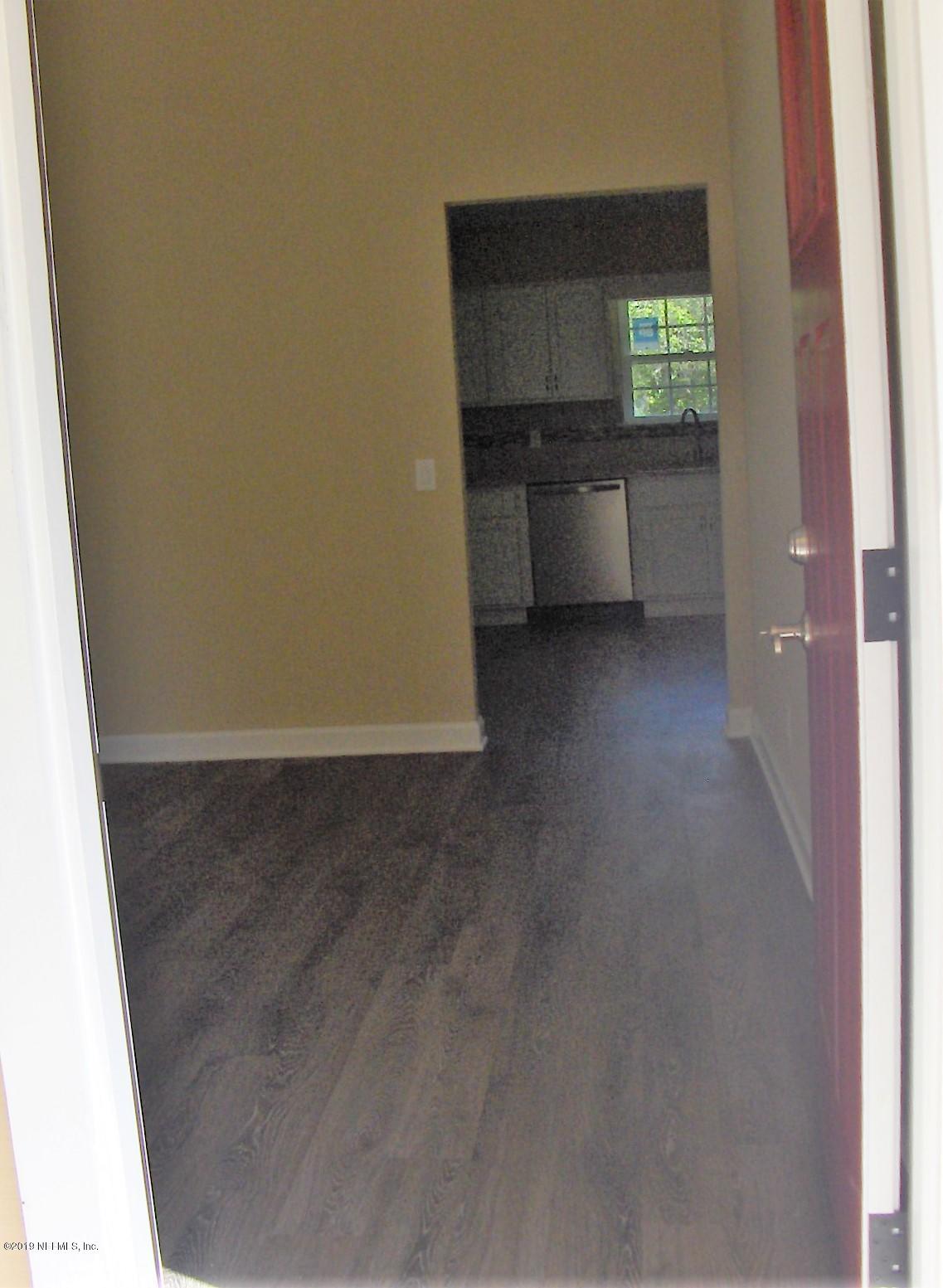 4122 Appaloosa Road Middleburg, FL 32068 - Photo 11 of 18 a view of a kitchen cabinets a sink and a window