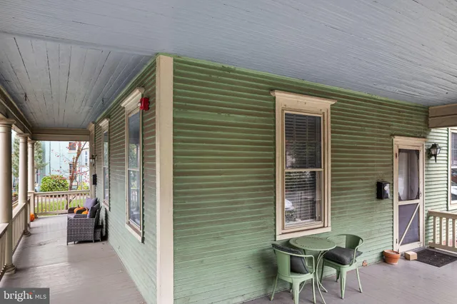 a view of a balcony and a back yard