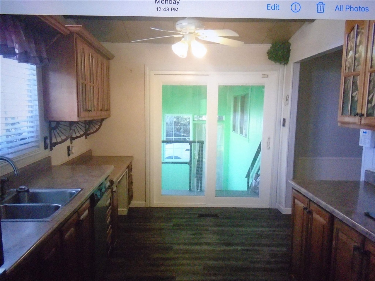 1200 South Carpenter Road, Unit 121 Modesto, CA 95351 - Photo 13 of 35 a kitchen with kitchen island a sink a stove and a window