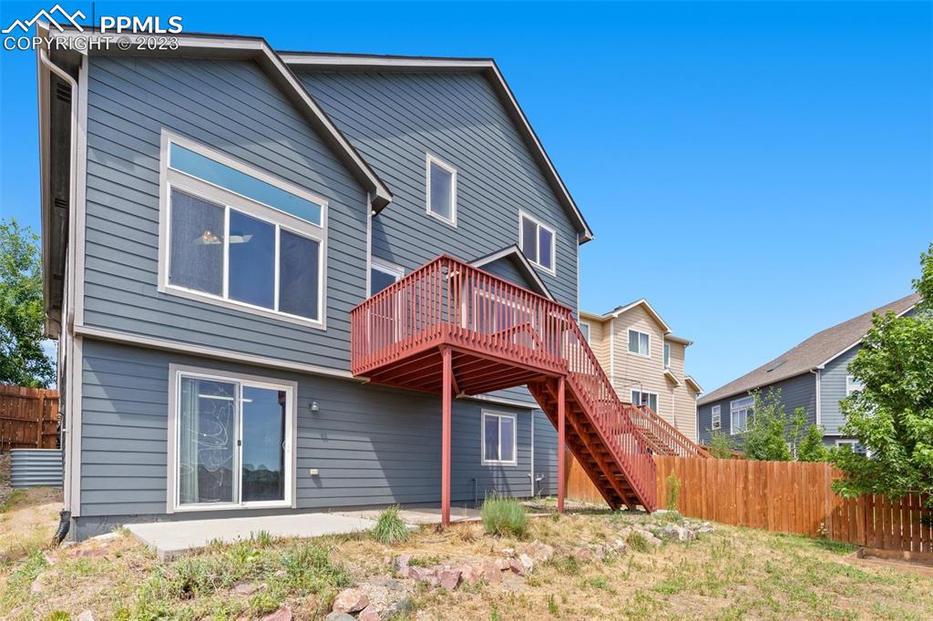 13099 Devil's Thumb Place Peyton, CO 80831 - Photo 25 of 25 a front view of a house with a yard
