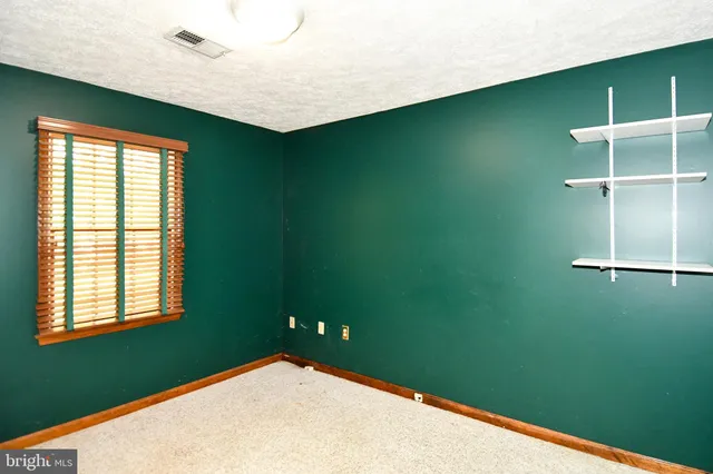 a view of a room that has a window