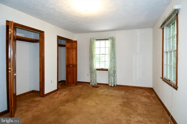 an empty room with windows