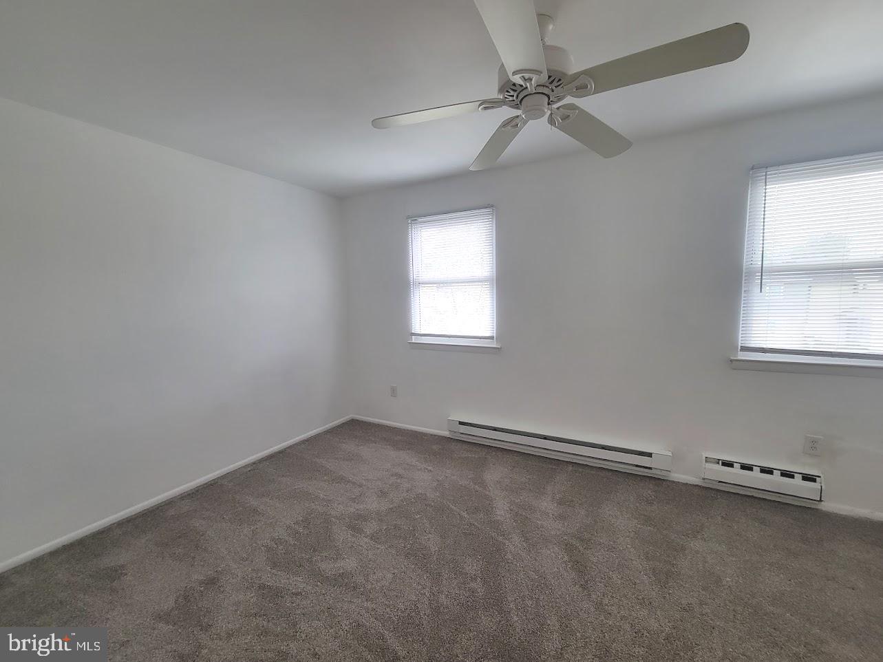 59 Noble Road Sicklerville, NJ 08081 - Photo 9 of 12 an empty room with windows and fan