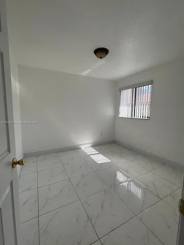 a bathroom with a toilet and shower