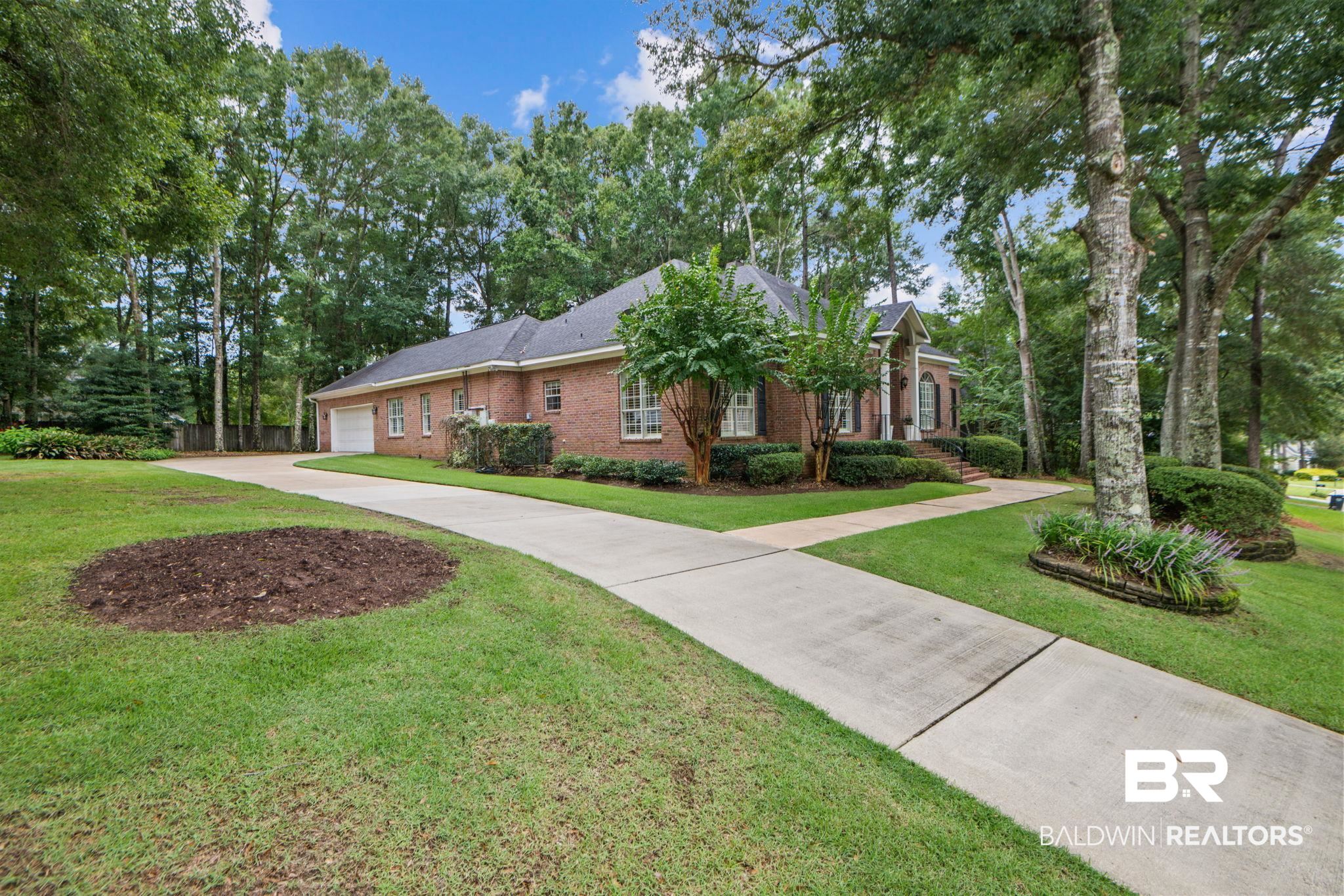 105 Beaver Dam Road Fairhope, AL 36532 - Photo 54 of 55 Ranch-style home with a garage and a front lawn