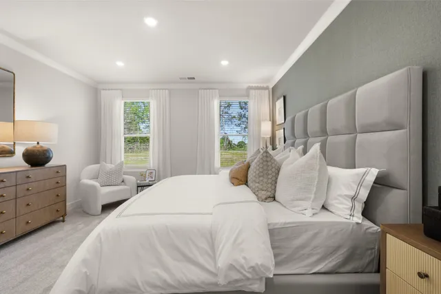 a bedroom with a bed and a couch