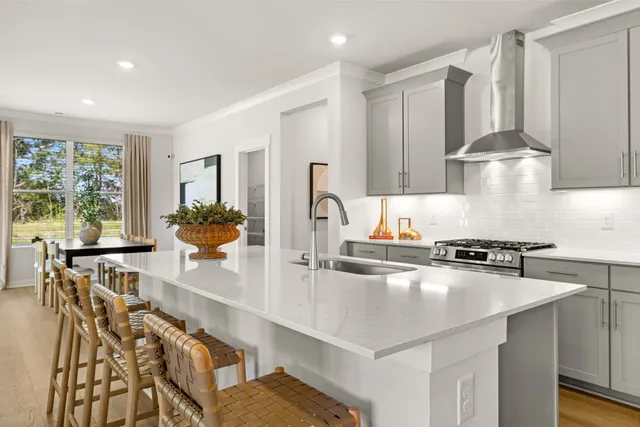 a kitchen with granite countertop a stove and a sink
