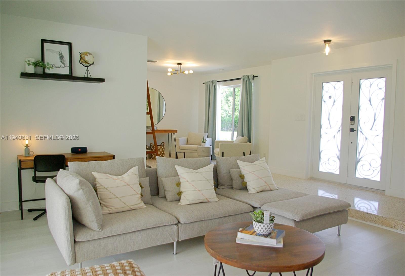 29450 Southwest 180th Avenue Homestead, FL 33030 - Photo 14 of 32 a living room with furniture and a large window