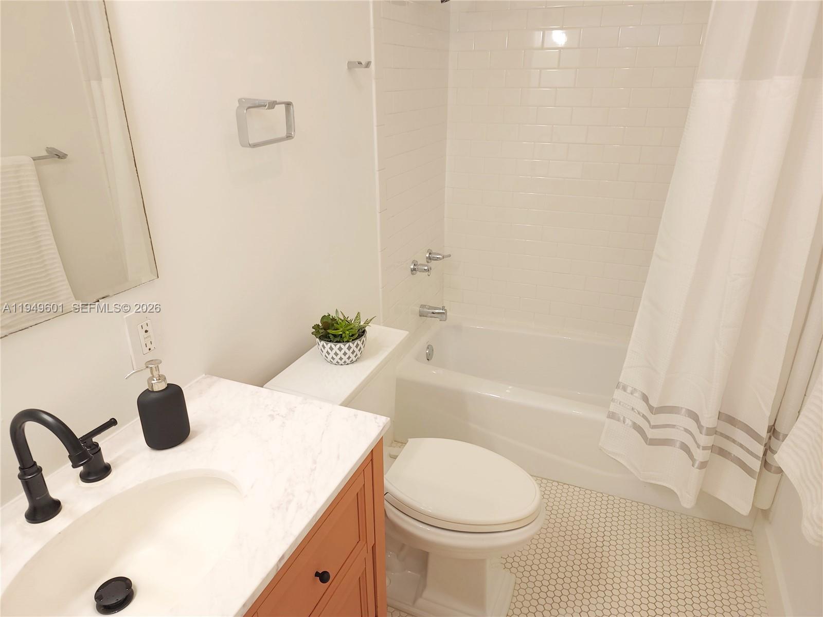 29450 Southwest 180th Avenue Homestead, FL 33030 - Photo 17 of 32 a bathroom with a sink toilet and shower