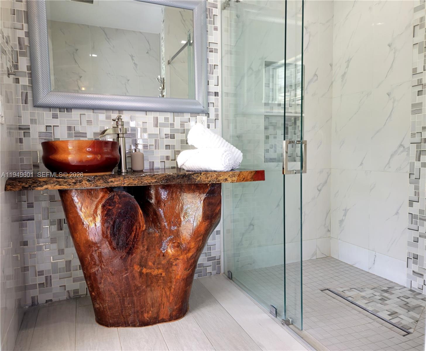 29450 Southwest 180th Avenue Homestead, FL 33030 - Photo 19 of 32 a bathroom with a sink and a mirror