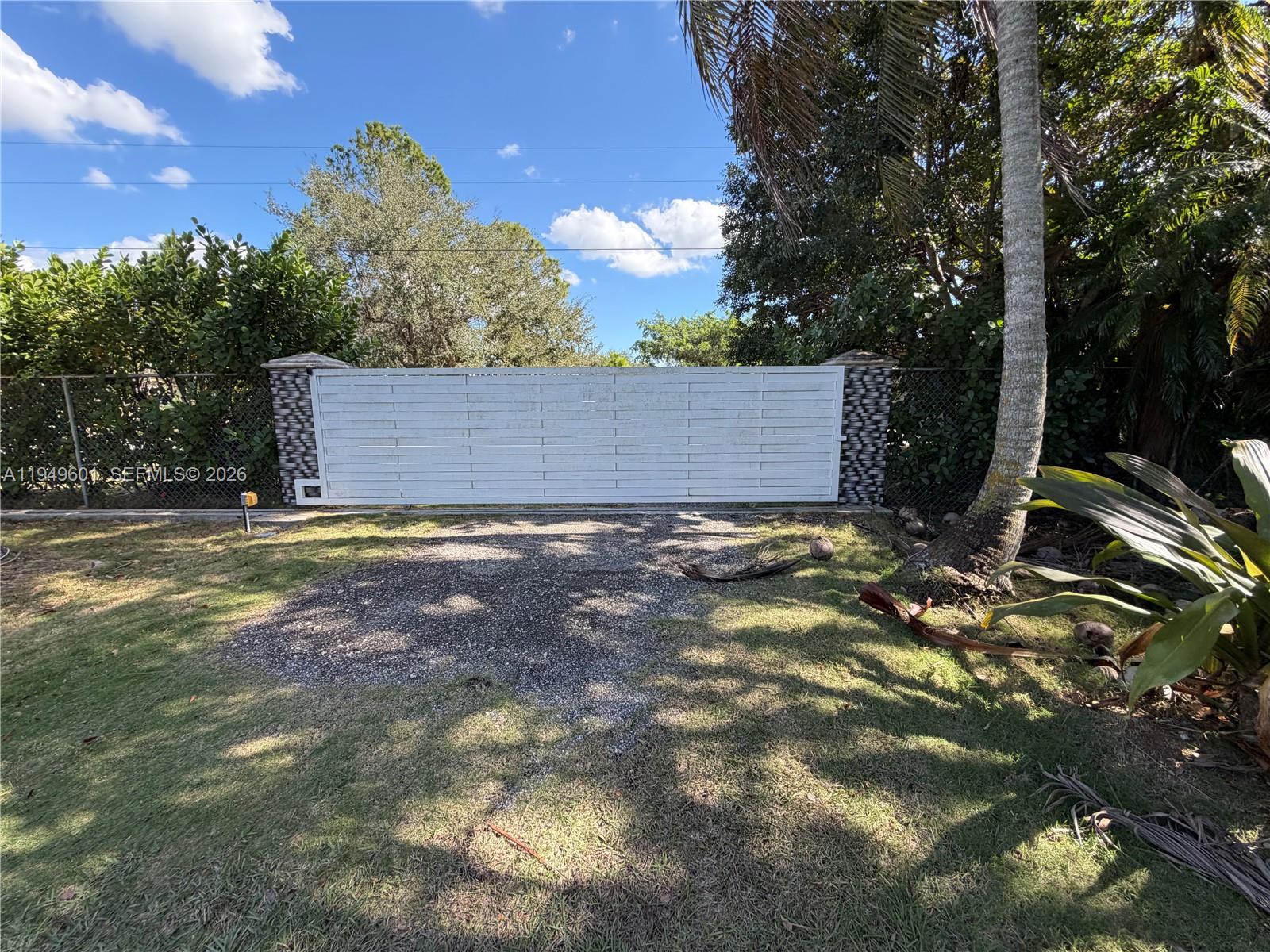 29450 Southwest 180th Avenue Homestead, FL 33030 - Photo 21 of 32 a view of a house with a yard