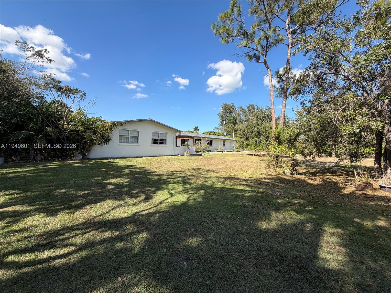 29450 Southwest 180th Avenue Homestead, FL 33030 - Photo 22 of 32 a view of a house with a yard