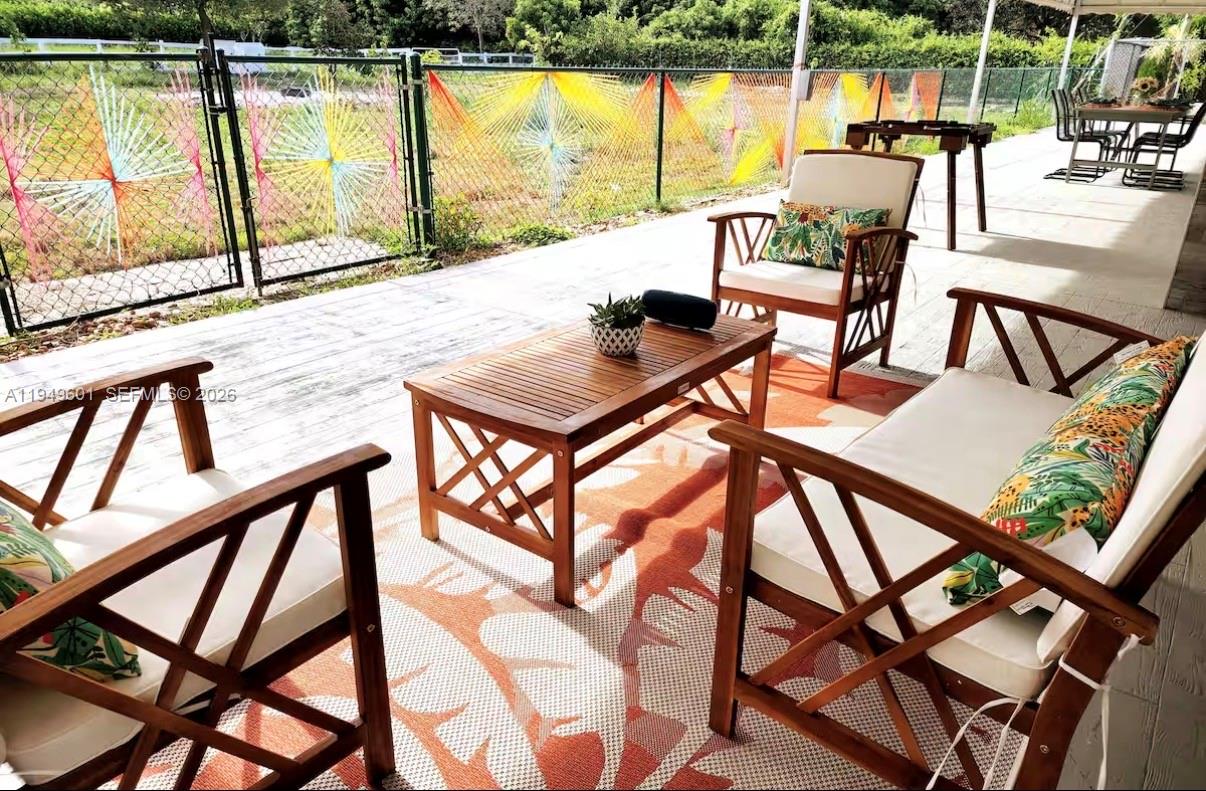 29450 Southwest 180th Avenue Homestead, FL 33030 - Photo 32 of 32 a view of swimming pool with outdoor seating