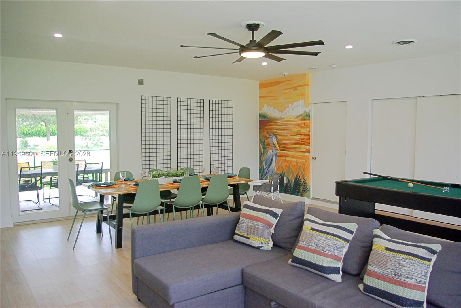 29450 Southwest 180th Avenue Homestead, FL 33030 - Photo 6 of 32 a living room with furniture and floor to ceiling windows