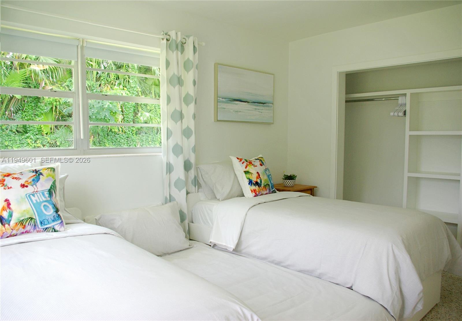 29450 Southwest 180th Avenue Homestead, FL 33030 - Photo 10 of 32 a bedroom with a bed and a window