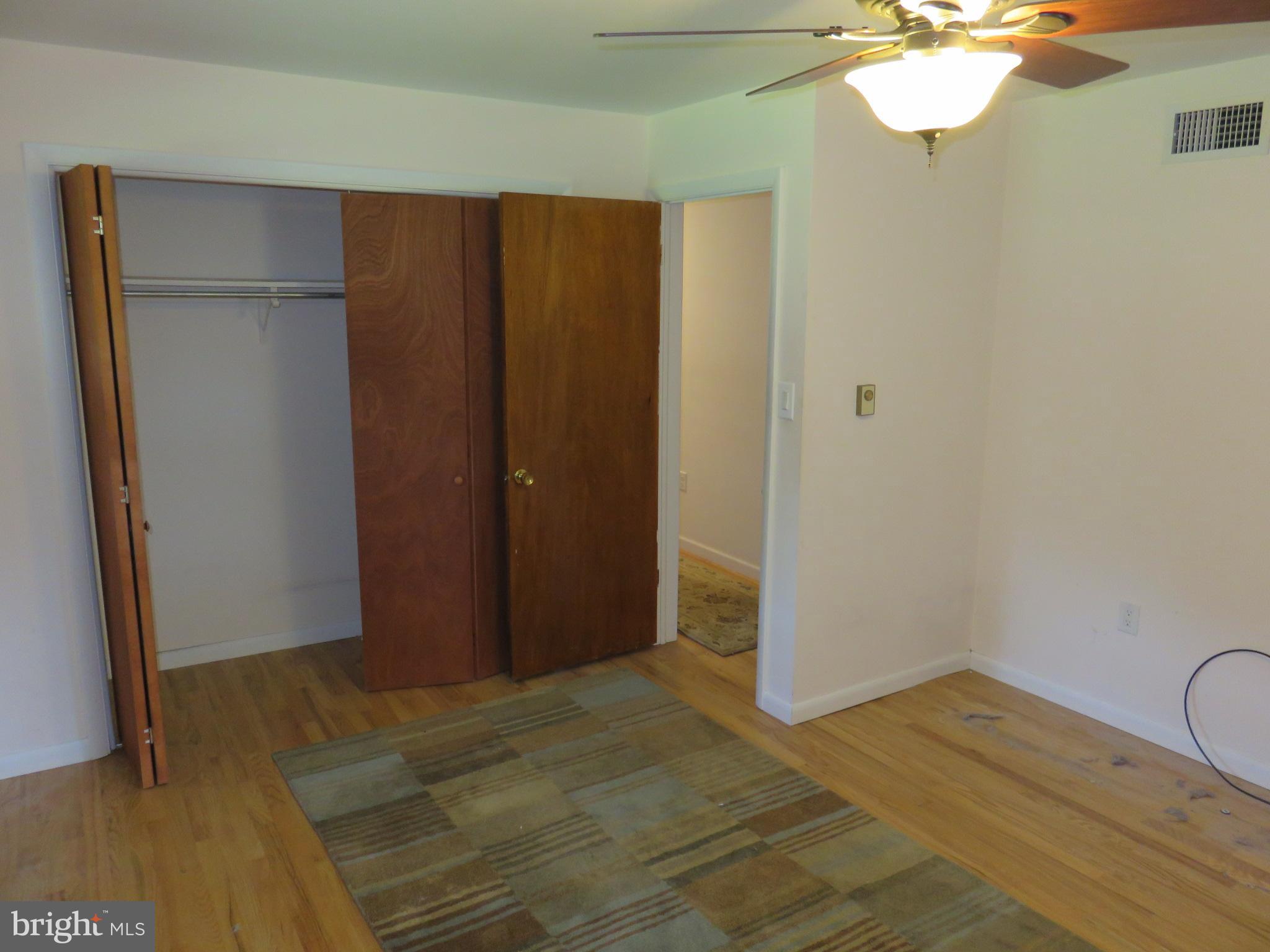 292 Hill Road Denver, PA 17517 - Photo 22 of 42 a view of a room with wooden floor and staircase