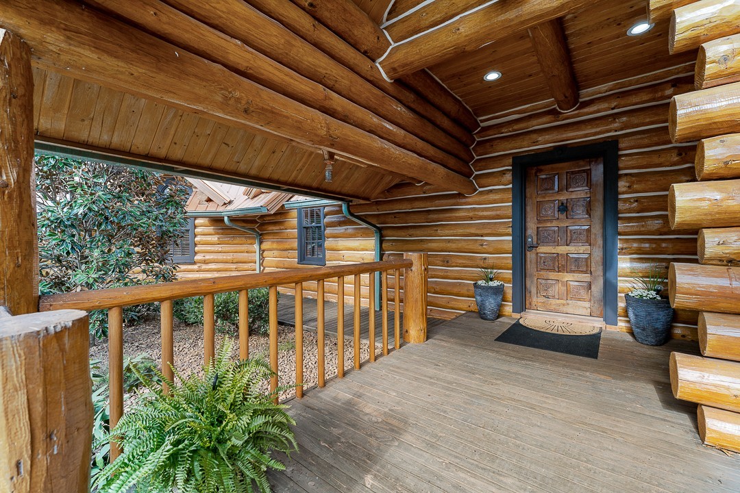562 Rocky Ridge Road East Rock Island, TN 38581 - Photo 11 of 69 a view of a porch with wooden floor and stairs