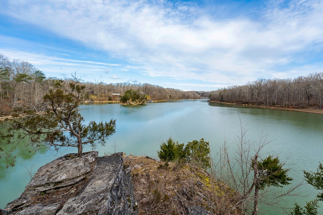 562 Rocky Ridge Road East Rock Island, TN 38581 - Photo 2 of 69 a view of a lake with houses in the back