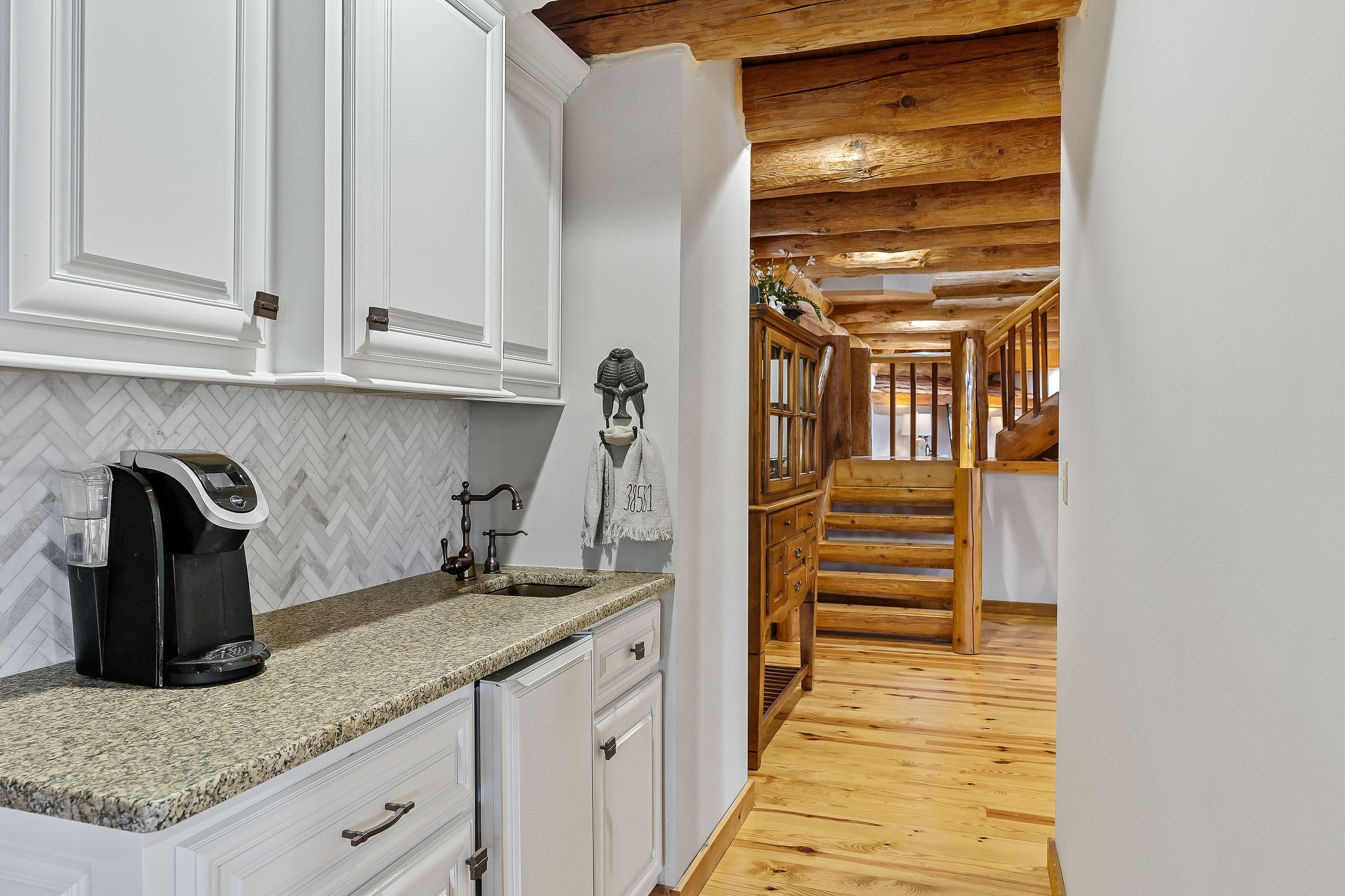 562 Rocky Ridge Road East Rock Island, TN 38581 - Photo 28 of 69 a kitchen with granite countertop a sink and cabinets