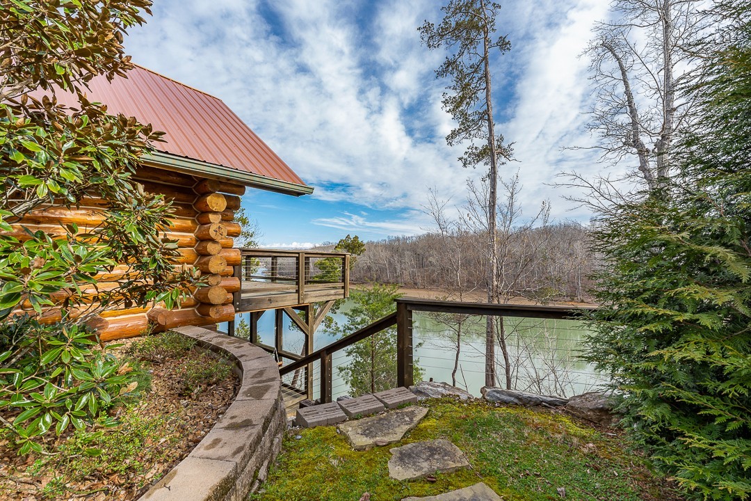 562 Rocky Ridge Road East Rock Island, TN 38581 - Photo 55 of 69 a backyard of a house with table and chairs