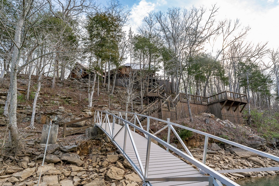 562 Rocky Ridge Road East Rock Island, TN 38581 - Photo 60 of 69 a view of balcony with wooden floor and fence and trees
