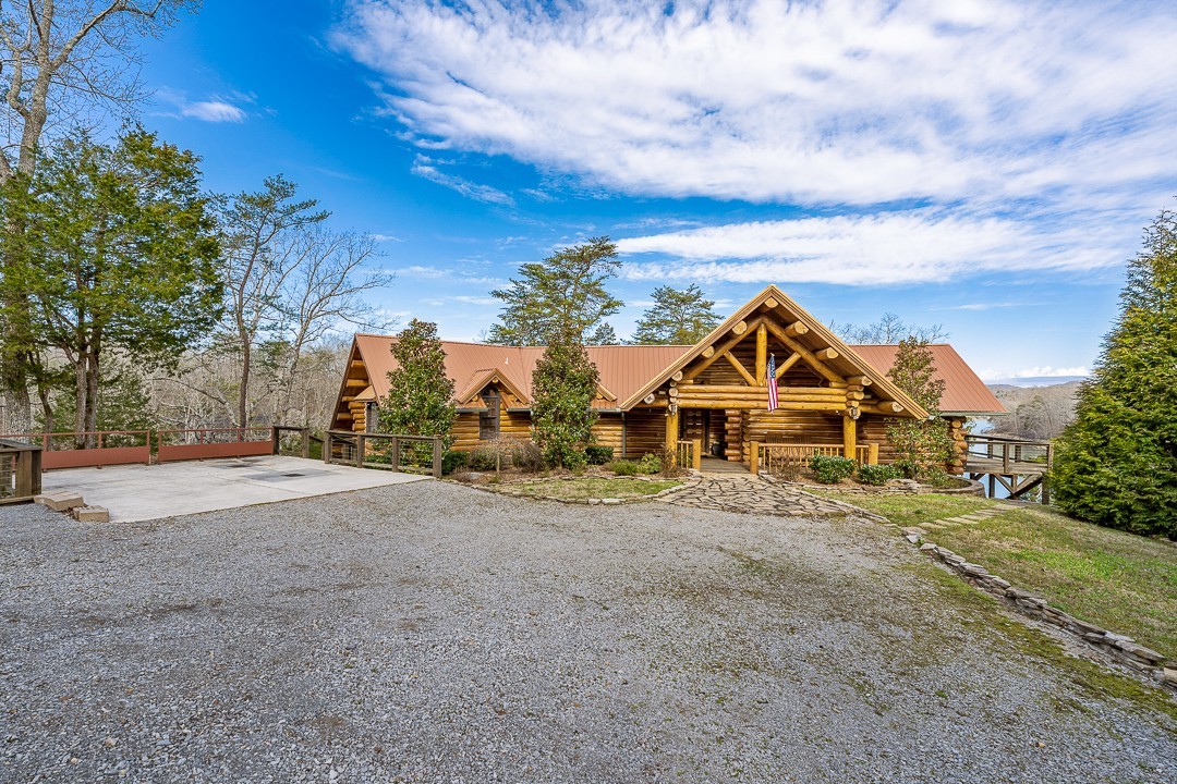 562 Rocky Ridge Road East Rock Island, TN 38581 - Photo 66 of 69 a view of a house with a big yard plants and large trees