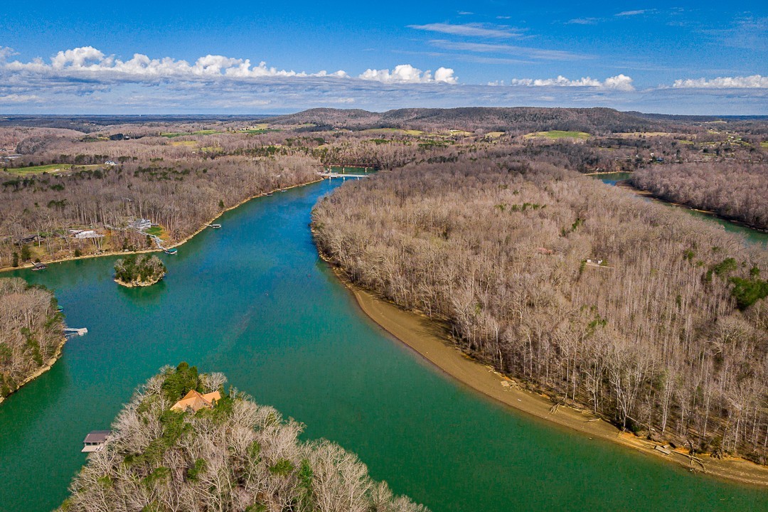 562 Rocky Ridge Road East Rock Island, TN 38581 - Photo 7 of 69 a view of a lake with a mountain in the background