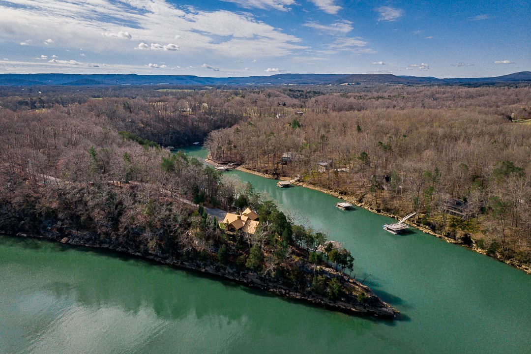 562 Rocky Ridge Road East Rock Island, TN 38581 - Photo 8 of 69 a view of a lake with a mountain in the background