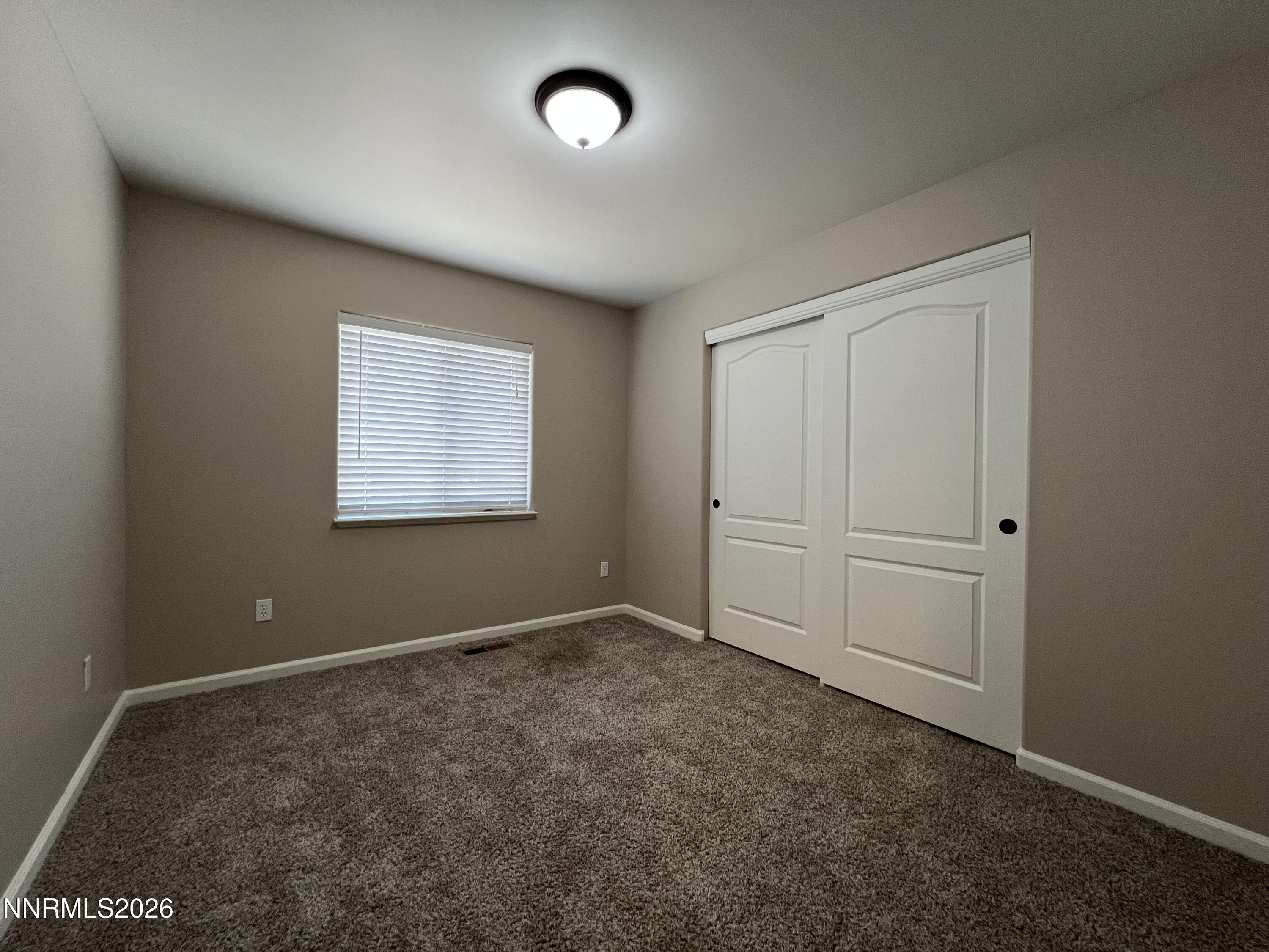 18406 Teddy Bear Court Reno, NV 89508 - Photo 26 of 44 an empty room with windows