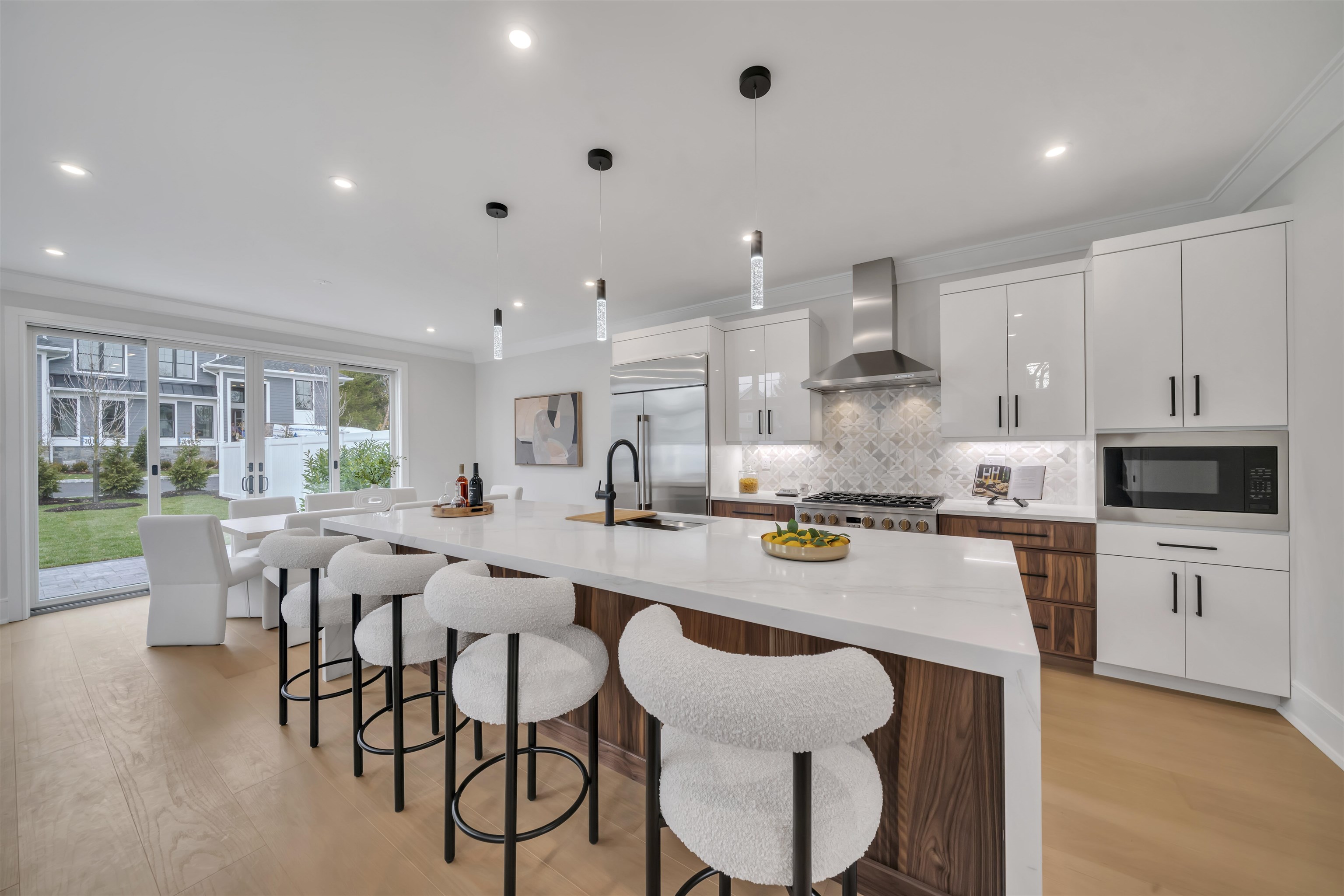 a large kitchen with a table and chairs