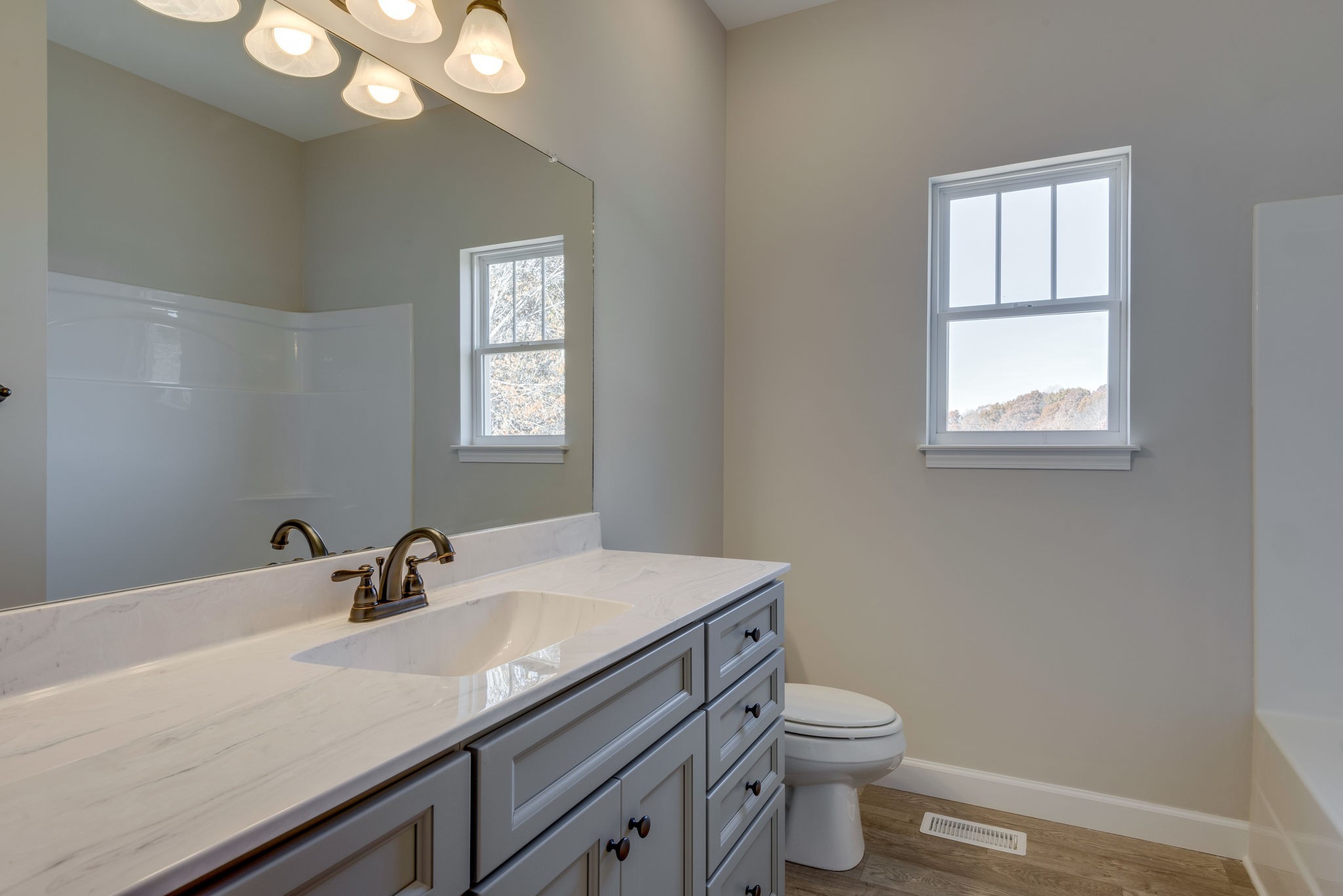 541 Murrell Road Dickson, TN 37055 - Photo 12 of 25 a bathroom with a sink a toilet and a mirror