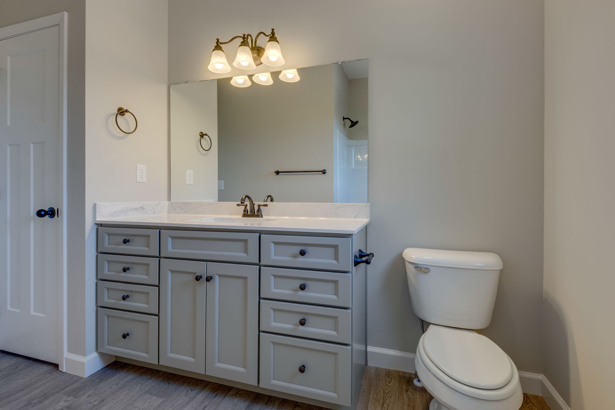 541 Murrell Road Dickson, TN 37055 - Photo 16 of 25 a bathroom with a toilet a sink and mirror