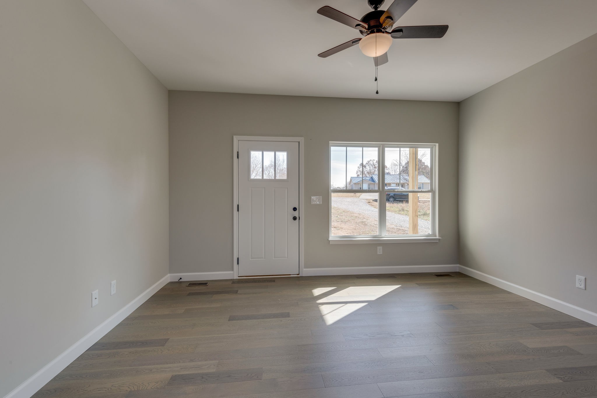 541 Murrell Road Dickson, TN 37055 - Photo 3 of 25 an empty room with chandelier fan and windows