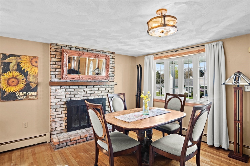 4 Jeffrey Road Billerica, MA 01821 - Photo 12 of 34 a view of a dining room with furniture wooden floor and a chandelier