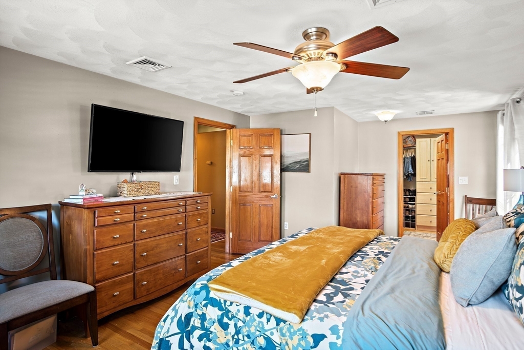 4 Jeffrey Road Billerica, MA 01821 - Photo 19 of 34 a bedroom with a bed and a flat screen tv