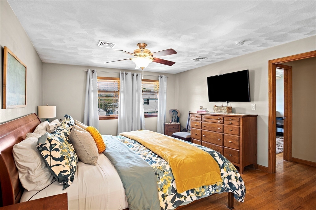 4 Jeffrey Road Billerica, MA 01821 - Photo 21 of 34 a bedroom with a bed and a flat screen tv