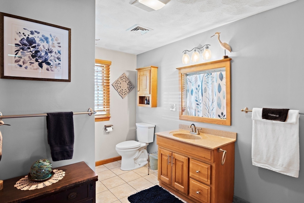 4 Jeffrey Road Billerica, MA 01821 - Photo 28 of 34 a spacious bathroom with a sink a toilet and a mirror