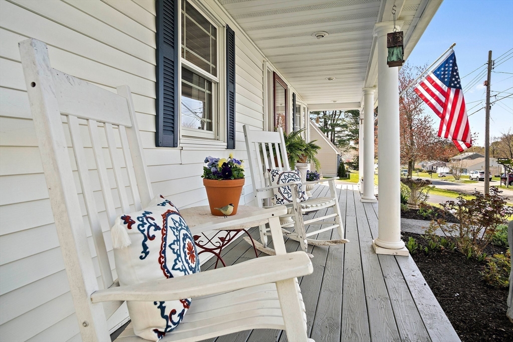 4 Jeffrey Road Billerica, MA 01821 - Photo 3 of 34 a view of a balcony with chairs and wooden floor