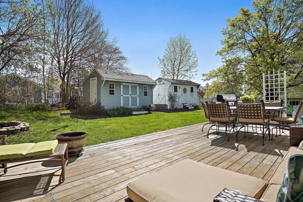 4 Jeffrey Road Billerica, MA 01821 - Photo 32 of 34 a view of a patio with a table chairs and a yard