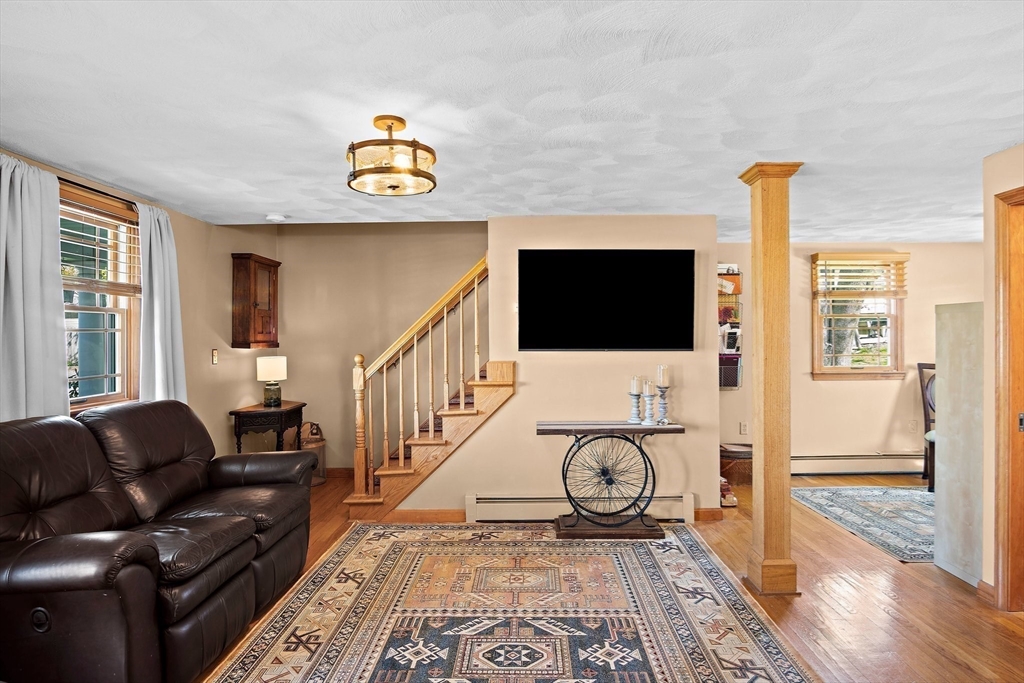 4 Jeffrey Road Billerica, MA 01821 - Photo 8 of 34 a living room with furniture and a flat screen tv