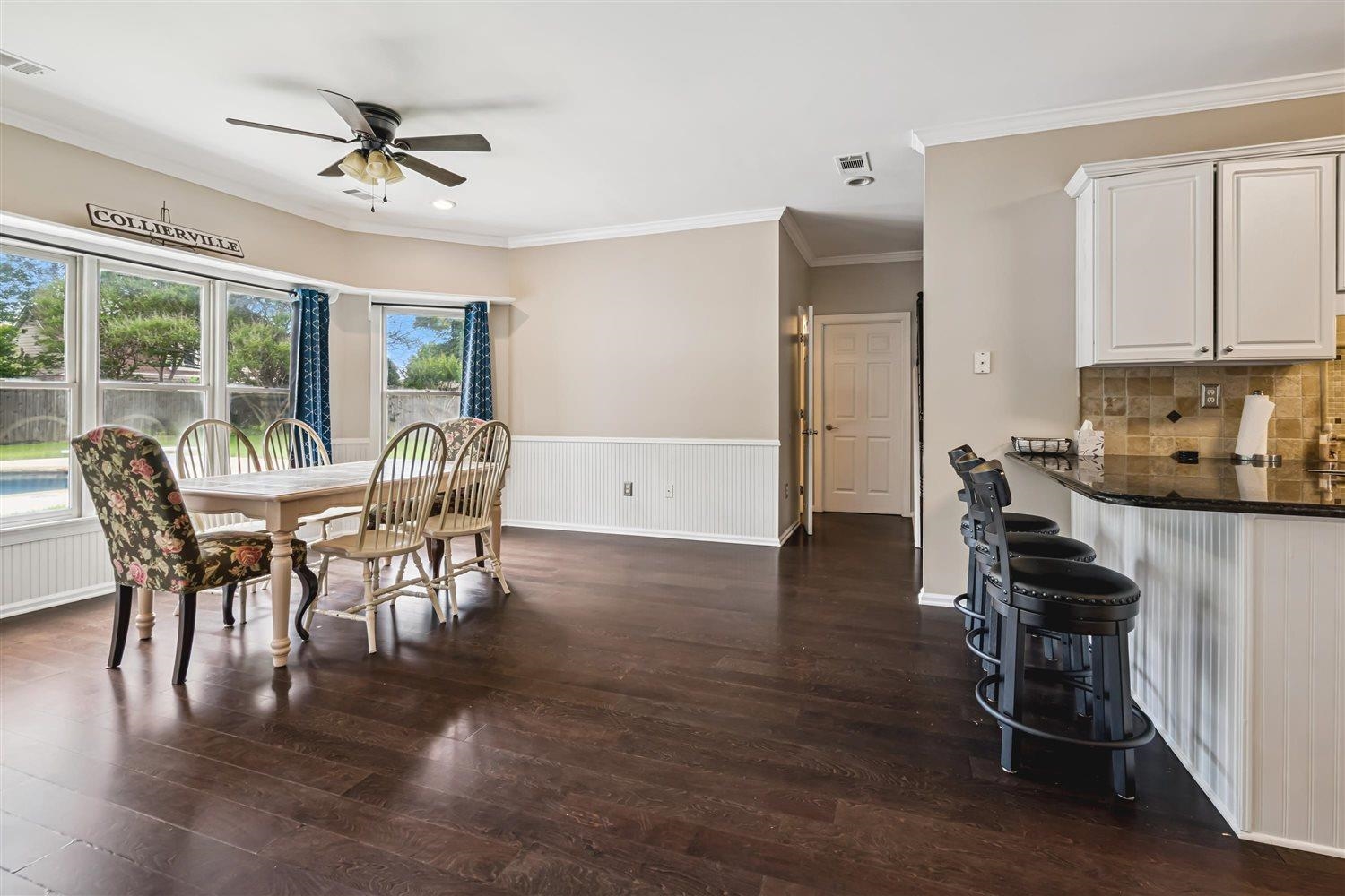 1489 John Ridge Drive Collierville, TN 38017 - Photo 13 of 39 a view of a dining room with furniture window and wooden floor
