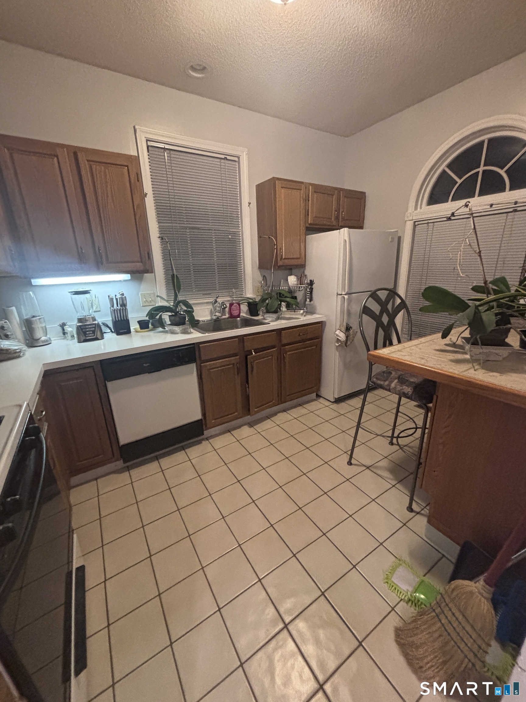 101 Madeline Avenue, Unit 33 Waterbury, CT 06708 - Photo 13 of 41 a kitchen with a sink and a stove top oven