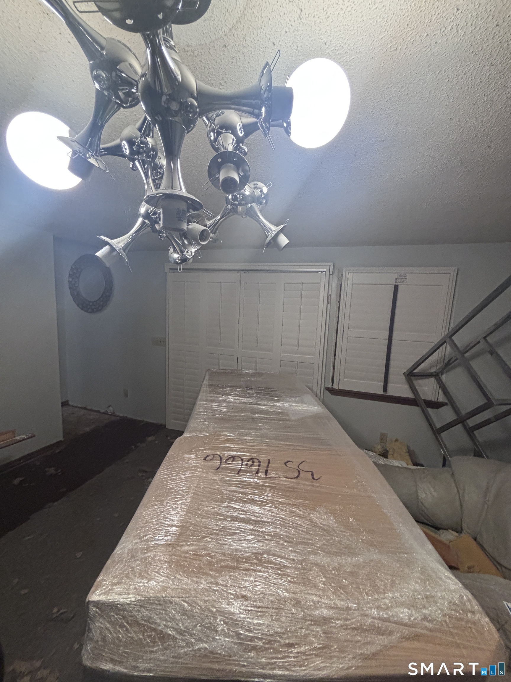 101 Madeline Avenue, Unit 33 Waterbury, CT 06708 - Photo 18 of 41 a view of a chandelier in a room