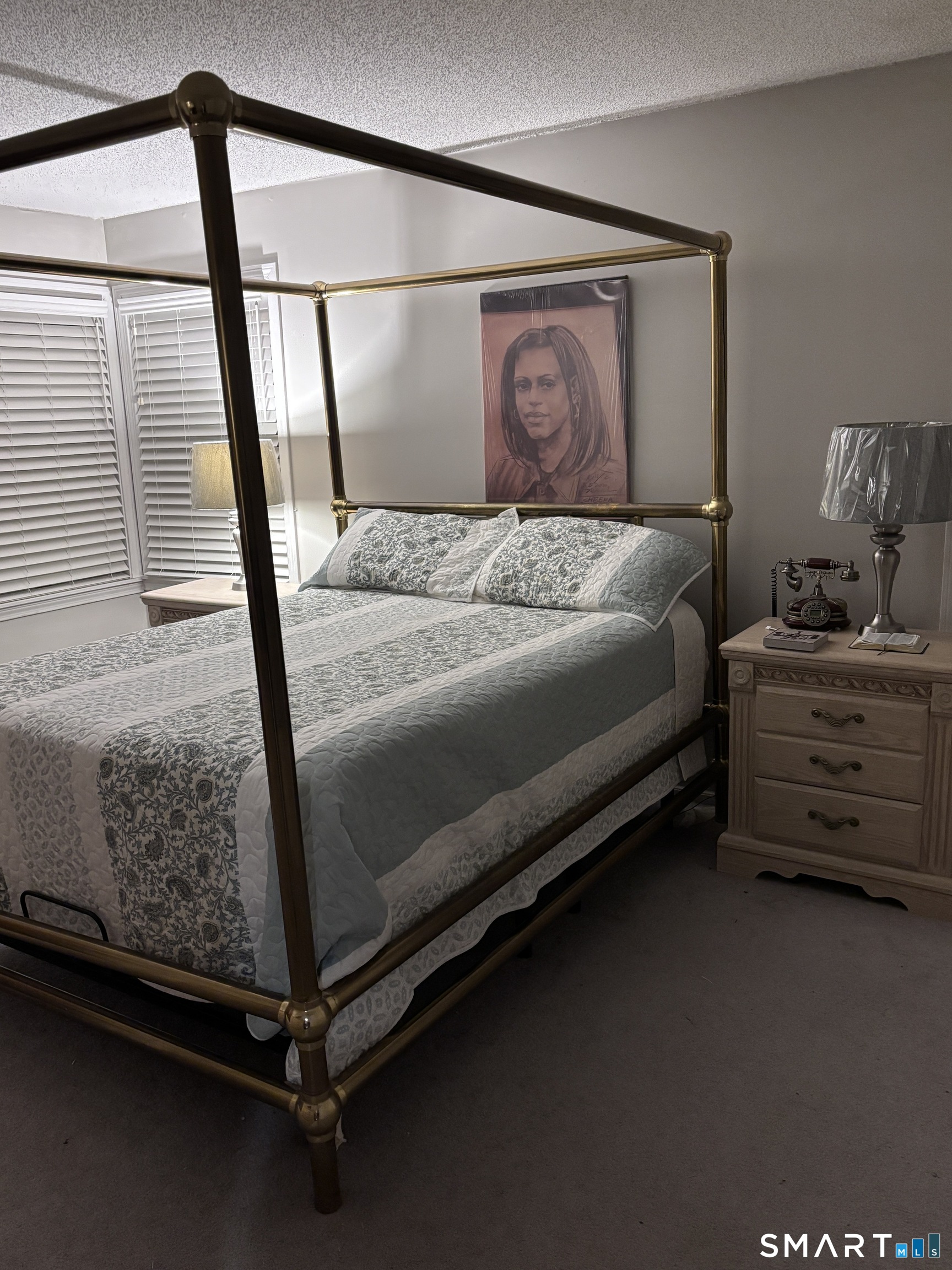 101 Madeline Avenue, Unit 33 Waterbury, CT 06708 - Photo 21 of 41 a bedroom with a bed and a mirror