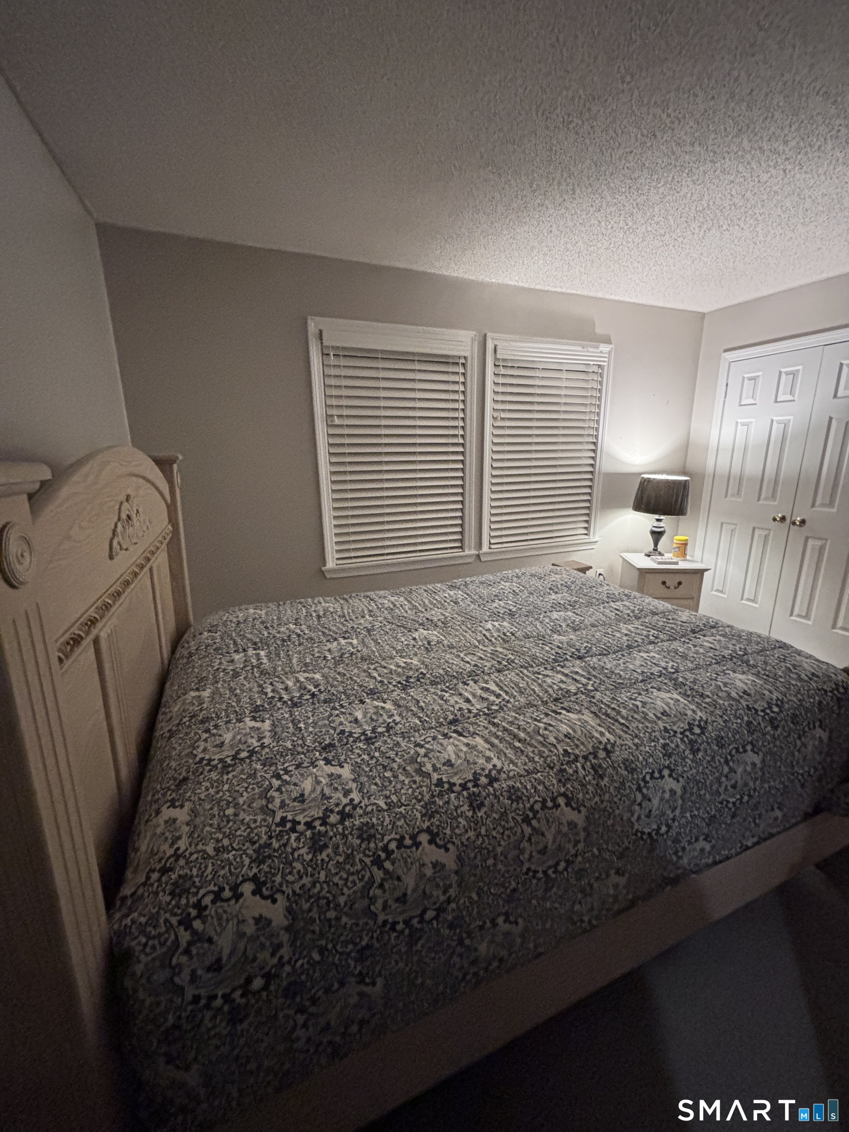 101 Madeline Avenue, Unit 33 Waterbury, CT 06708 - Photo 24 of 41 a bedroom with a bed and a window