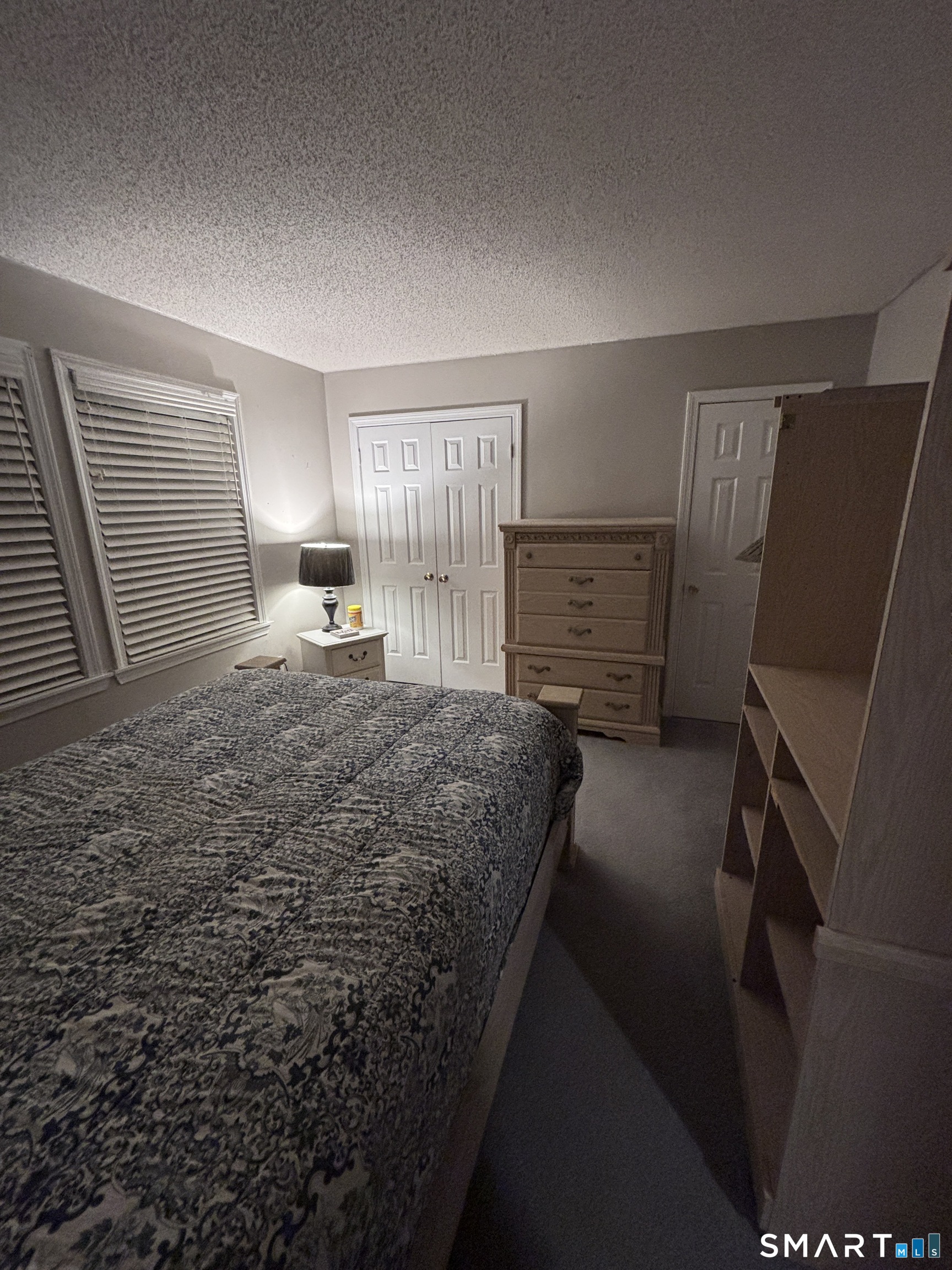 101 Madeline Avenue, Unit 33 Waterbury, CT 06708 - Photo 26 of 41 a room with a bed and furniture