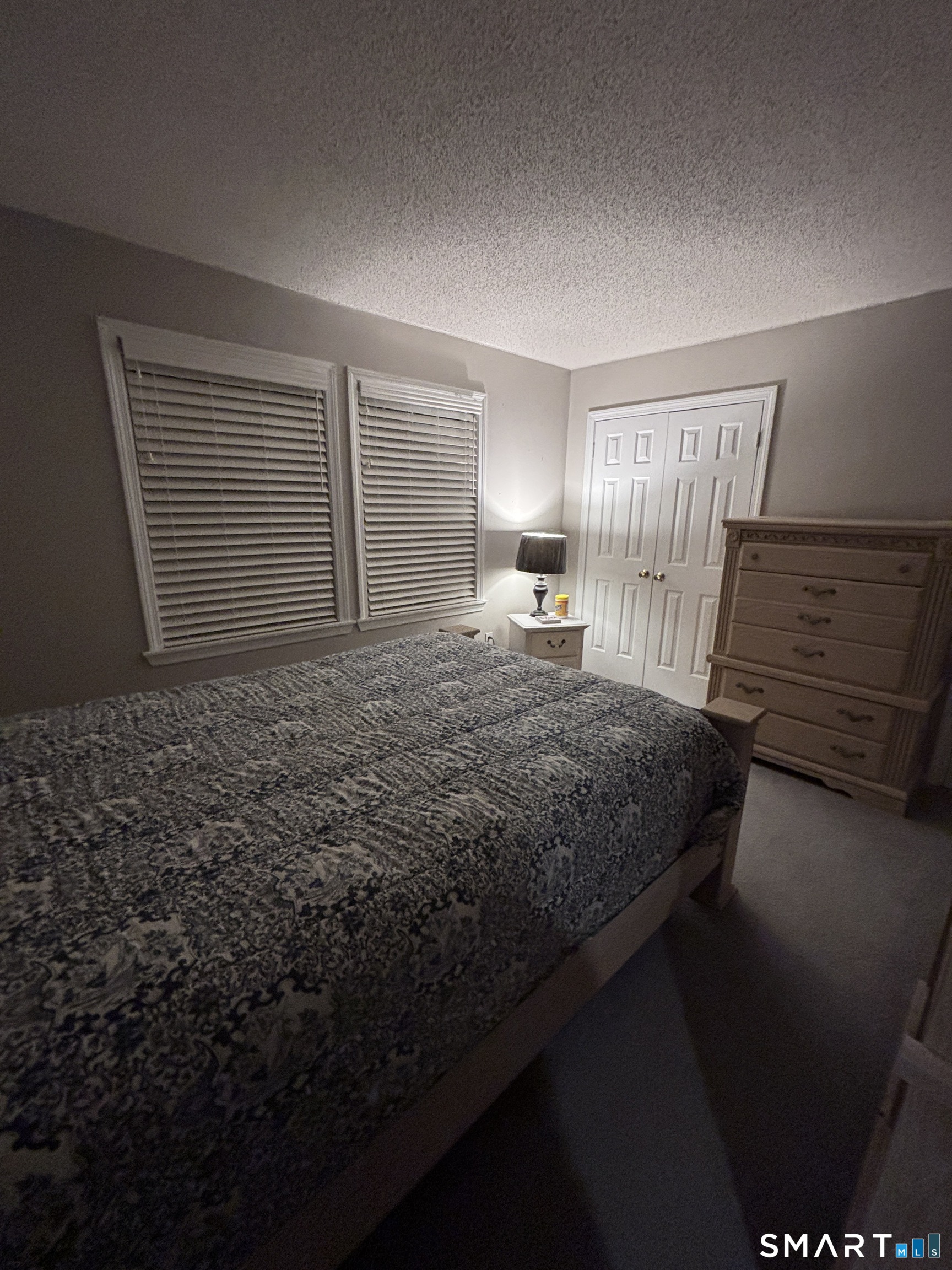 101 Madeline Avenue, Unit 33 Waterbury, CT 06708 - Photo 29 of 41 a bedroom with a bed and a window